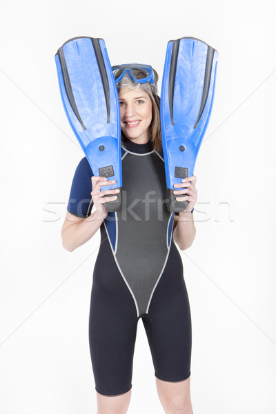 standing young woman wearing neoprene with flippers and diving g Stock photo © phbcz