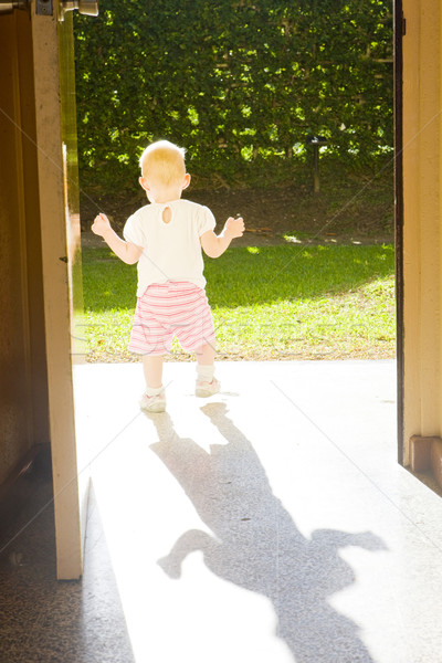 Kisgyerek áll ajtók gyerekek gyermek ajtó Stock fotó © phbcz
