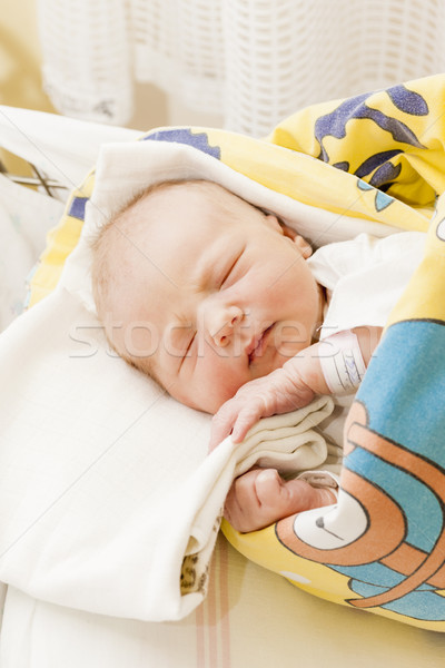 Stock photo: portrait of a newborn baby girl in maternal hospital