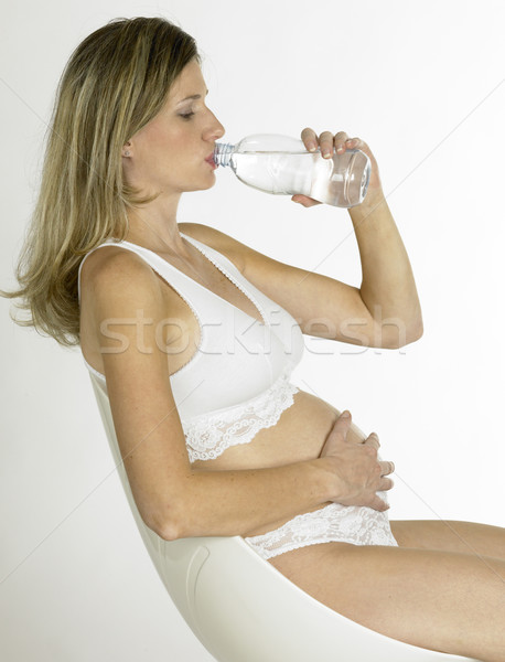 pregnat woman with a bottle of water Stock photo © phbcz