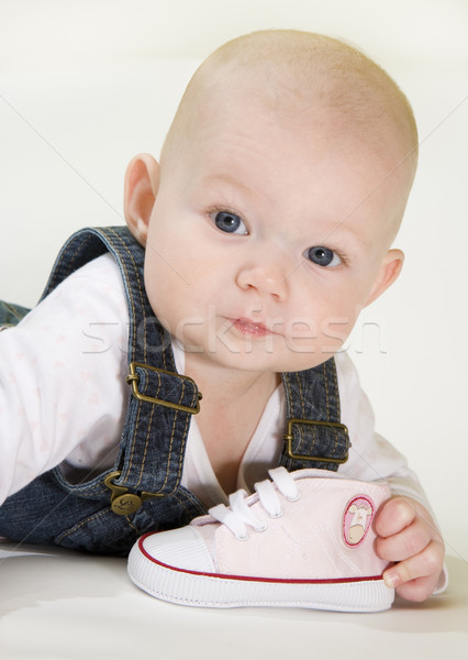 Portré fekszik kislány tart cipő gyerekek Stock fotó © phbcz