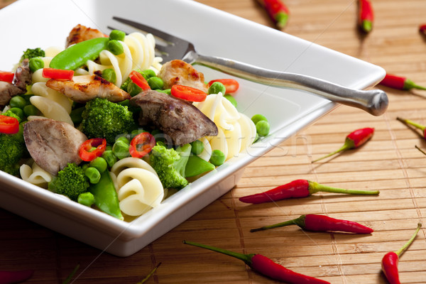 pasta with green vegetables and poultry meat Stock photo © phbcz