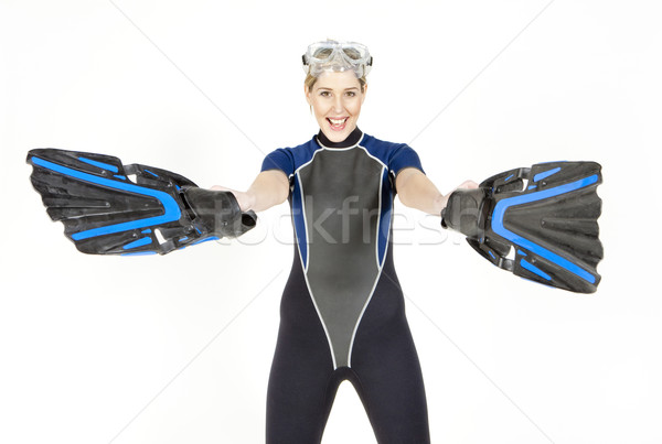standing young woman wearing neoprene with flippers and diving g Stock photo © phbcz