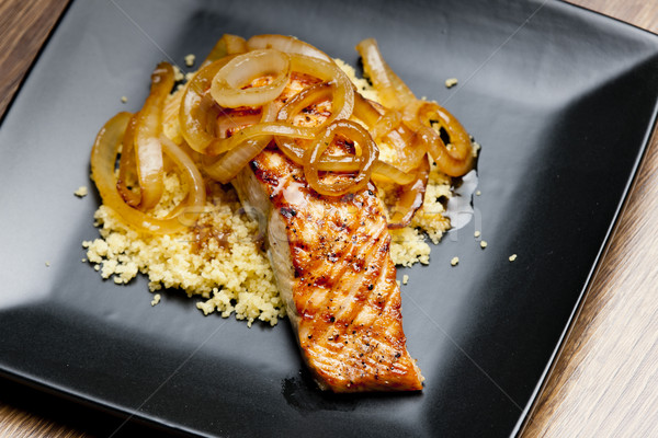 grilled salmon with burned onion and couscous Stock photo © phbcz