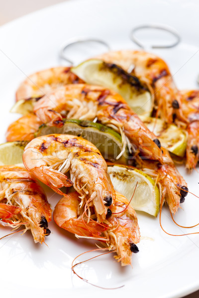 grilled skewers of prawns and lime in honey sauce Stock photo © phbcz