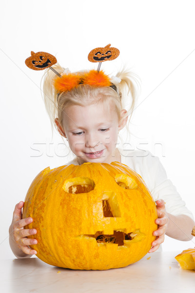 little girl carving pumpkin for Halloween Stock photo © phbcz