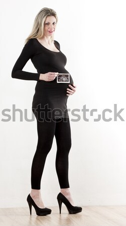 pregnant woman with a sonogram of her baby Stock photo © phbcz