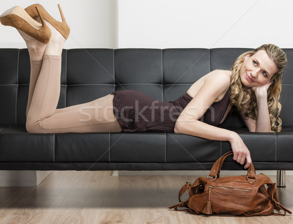 [[stock_photo]]: Femme · sac · à · main · canapé · chaussures · personne