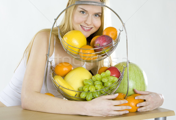 woman during breakfast with fruit Stock photo © phbcz