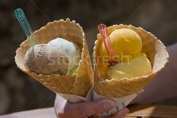 hand holding cones with ice cream Stock photo © phbcz
