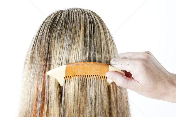 detail of woman combing long hair Stock photo © phbcz