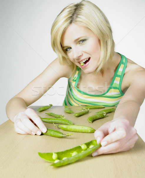 woman with pea pods Stock photo © phbcz