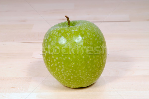 granite green apple on a wood table Stock photo © philipimage