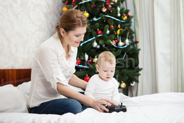 Young mother and son playing with RC controller Stock photo © photobac