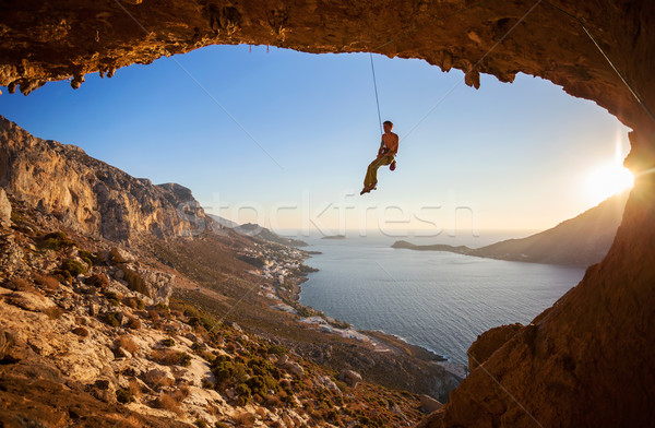 Rock climber hanging on rope while lead climbing Stock photo © photobac