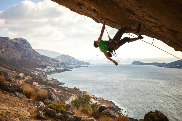 Male climber climbing overhanging rock Stock photo © photobac