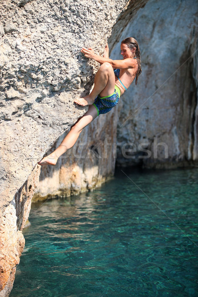 Deep water soloing, female climber on cliff Stock photo © photobac