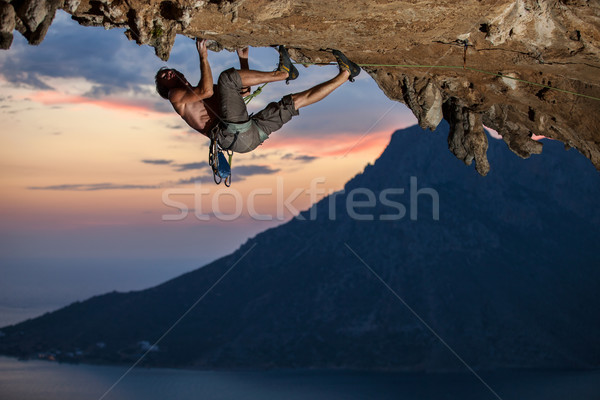 Rock climber at sunset Stock photo © photobac