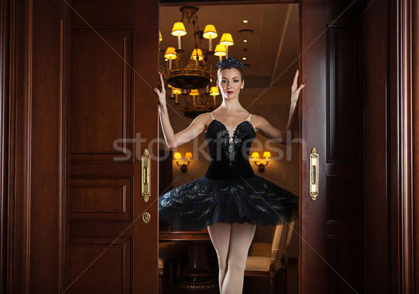 Ballerina in black tutu standing in doorway Stock photo © photobac