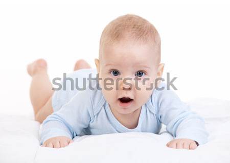 Little boy lying on stomach and looking at camera Stock photo © photobac