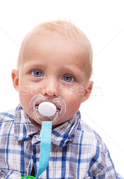 Cute blonde blue-eyed little boy with a pacifier Stock photo © photobac