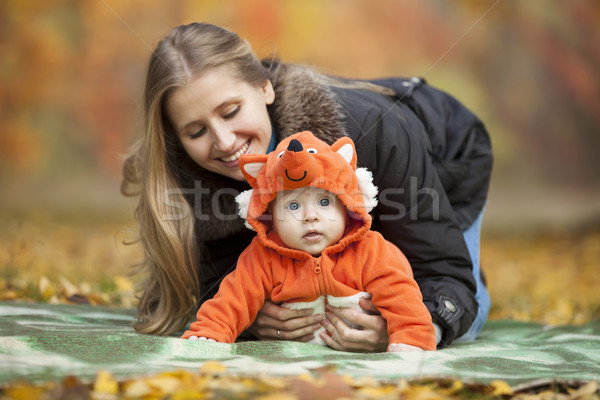 Young woman with baby dressed in fox costume Stock photo © photobac