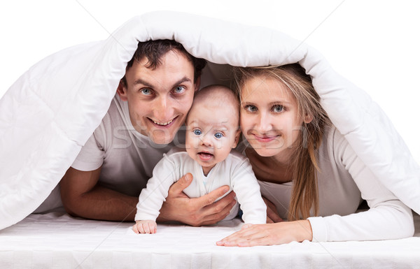 Fiatal család baba fiú pléd ágy Stock fotó © photobac