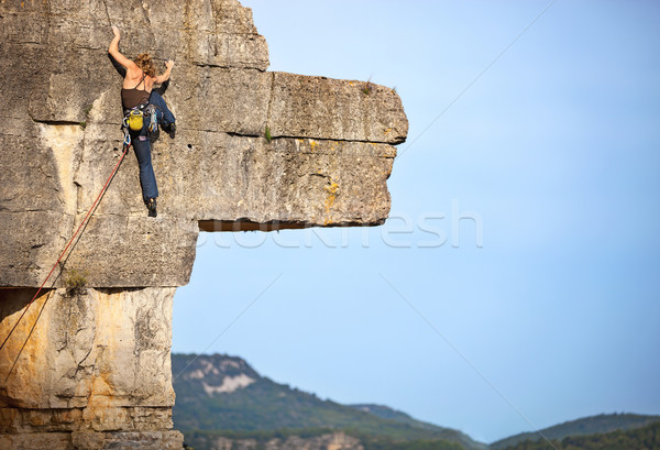 Young female rock climber on a cliff Stock photo © photobac