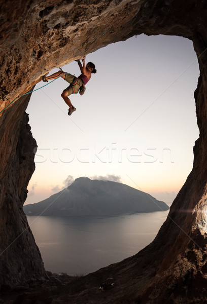 Female rock climber at sunset Stock photo © photobac