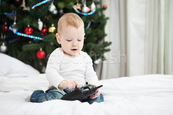 Baby boy holding RC controller at christmas time Stock photo © photobac
