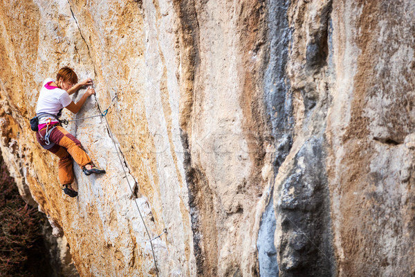Young female rock climber on a cliff Stock photo © photobac