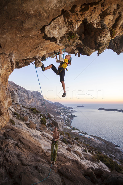 Seven-year old girl climbing a challenging route Stock photo © photobac