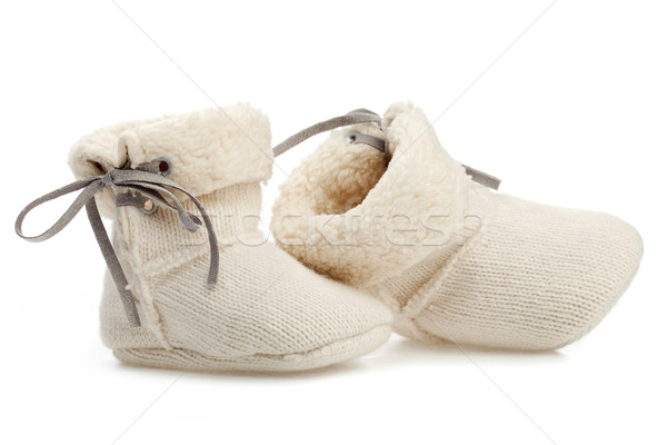 Stock photo: Pair of baby booties over white