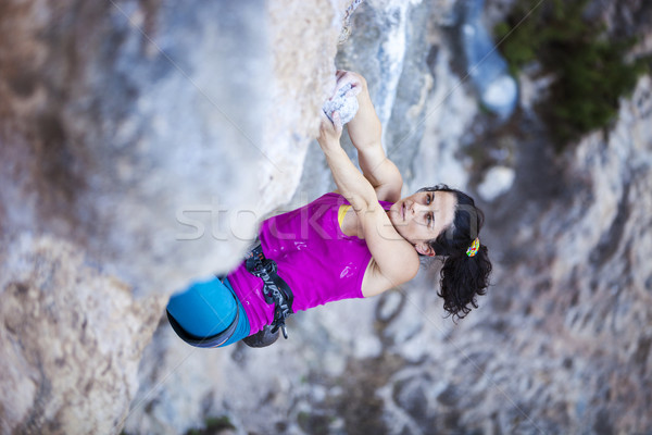 Female rock climber on a cliff face Stock photo © photobac