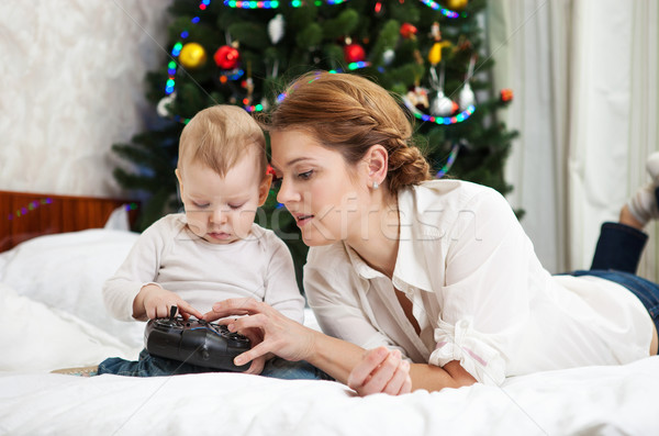Mother and toddler son playing with RC controller Stock photo © photobac