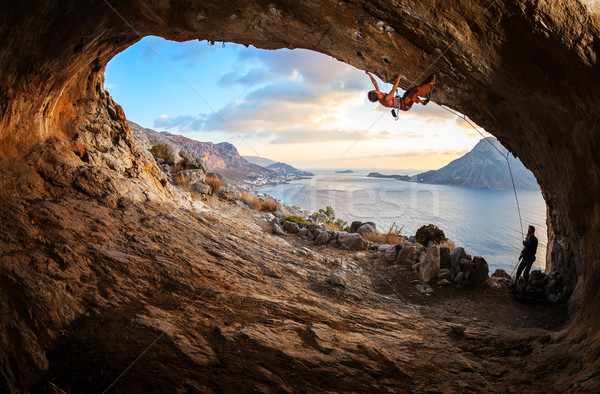 Young woman lead climbing in cave Stock photo © photobac