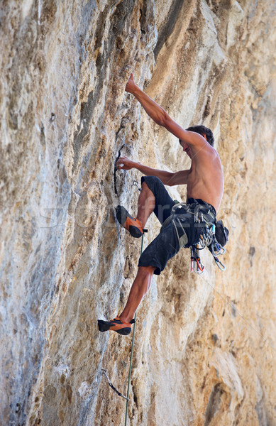 Rock climber on face of a cliff Stock photo © photobac