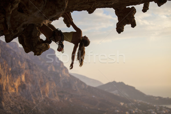 Female rock climber at sunset Stock photo © photobac