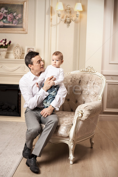 Giovane figlio seduta soggiorno poltrona uomo Foto d'archivio © photobac