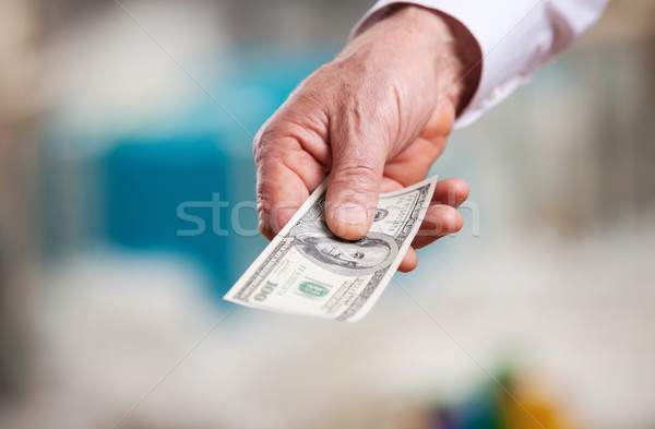 Hand with money on a Christmas background Stock photo © photobac