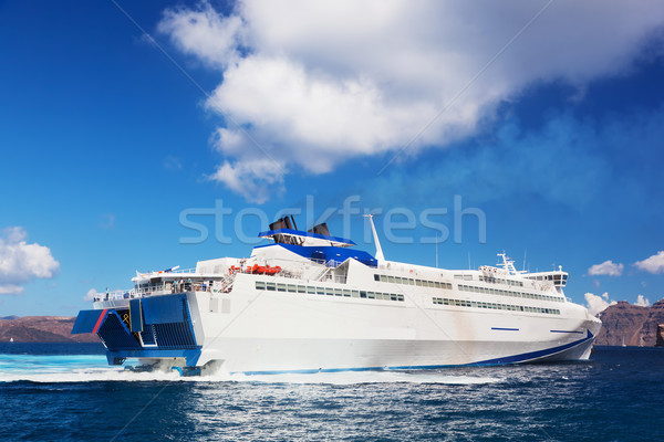 Modern cruise ship sailing on Aegean sea, Santorini island, Greece. Stock photo © photocreo