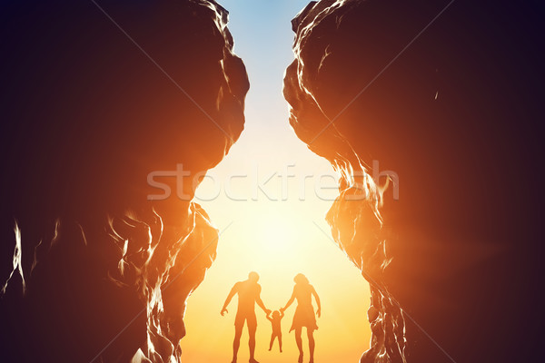 Happy family in between two mountains at the entrance of new better world. Stock photo © photocreo