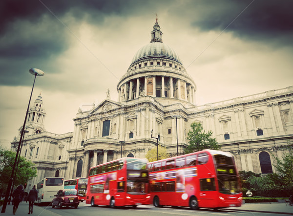 St Paul's Cathedral in London, the UK. Red buses, vintage style. Stock photo © photocreo