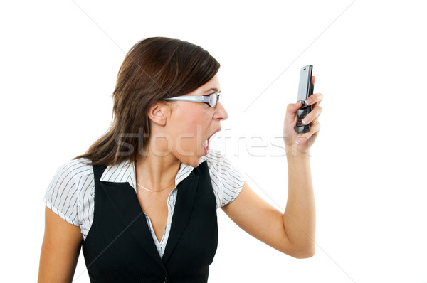 Angry businesswoman shouting to mobile Stock photo © photocreo