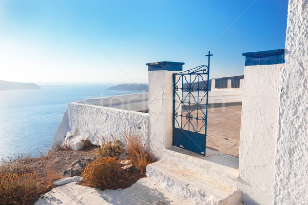 Gate to a church in Fira on Santorini island, Greece. Aegean sea view Stock photo © photocreo