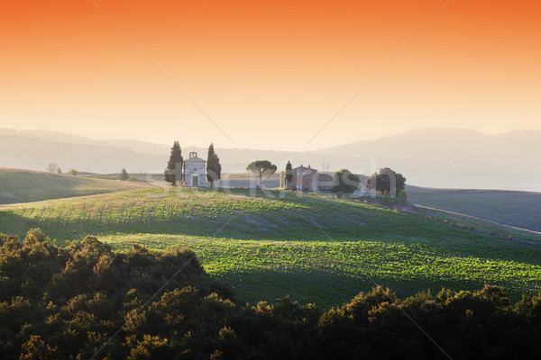 Tuscany landscape at sunrise with a little chapel of Madonna di Vitaleta, Italy. Stock photo © photocreo