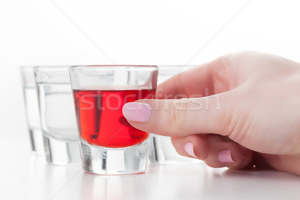 Woman's hand reaching for a glass of alcohol drink. Stock photo © photocreo