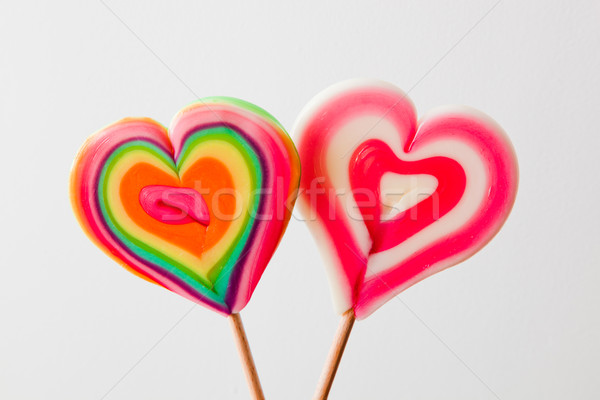 Colorful heart shaped lollipops on grey background Stock photo © photocreo