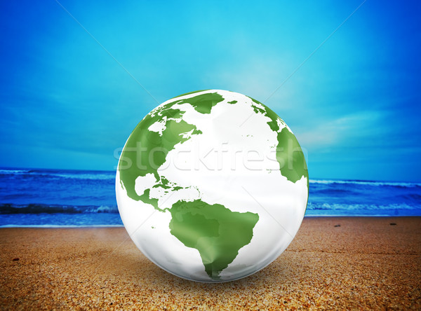 Planet earth model on the beach Stock photo © photocreo