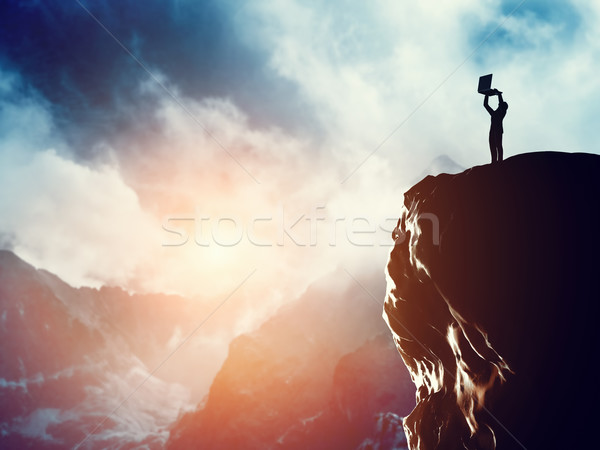 Férfi áll laptop csúcs hegy naplemente Stock fotó © photocreo